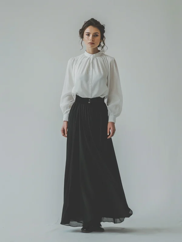 Kobieta w eleganckiej bluzce i długiej spódnicy - stylizacja pokazująca jak dobrać bluzkę do długiej spódnicy