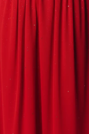 Czerwona spódnica maxi z błyszczącymi złotymi lub srebrnymi drobinkami.